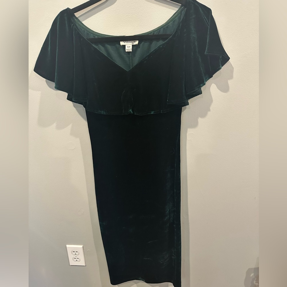 Emerald green velvet dress.